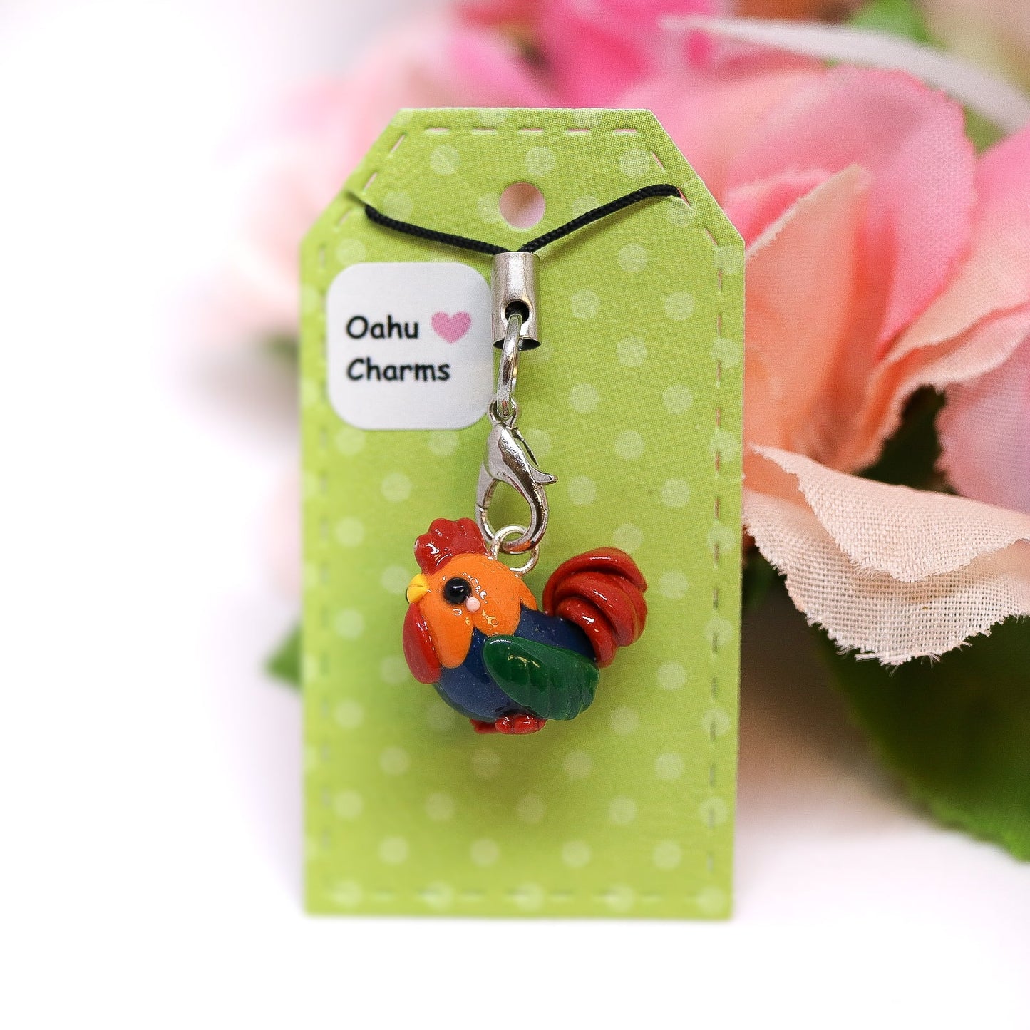 A cute, chubby colorful rooster charm. It has a little comb and yellow beak. This charm can be attached to a cell phone, purse, pouch, stitch marker, earrings, and more!