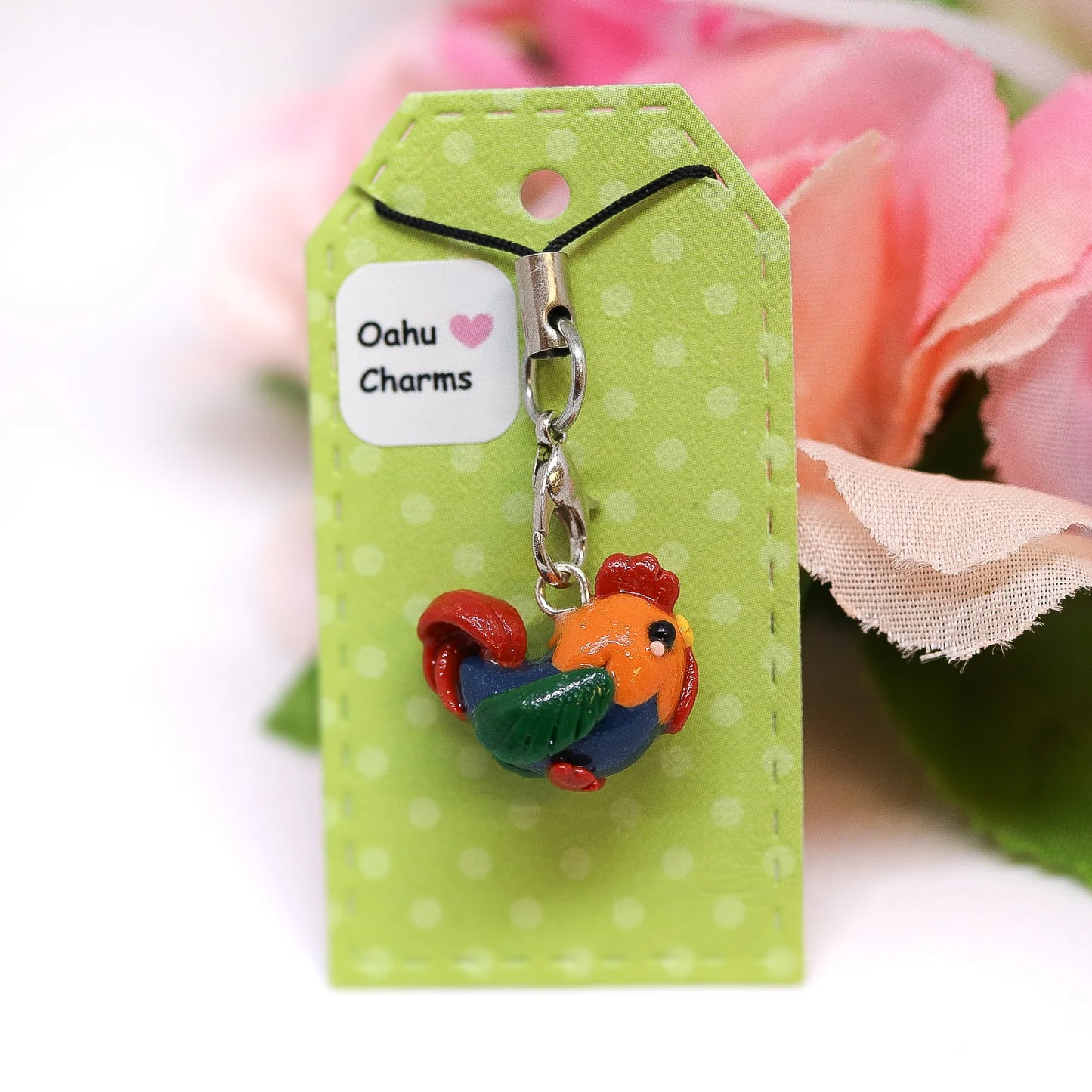 A cute, chubby colorful rooster charm. It has a little comb and yellow beak. This charm can be attached to a cell phone, purse, pouch, stitch marker, earrings, and more!