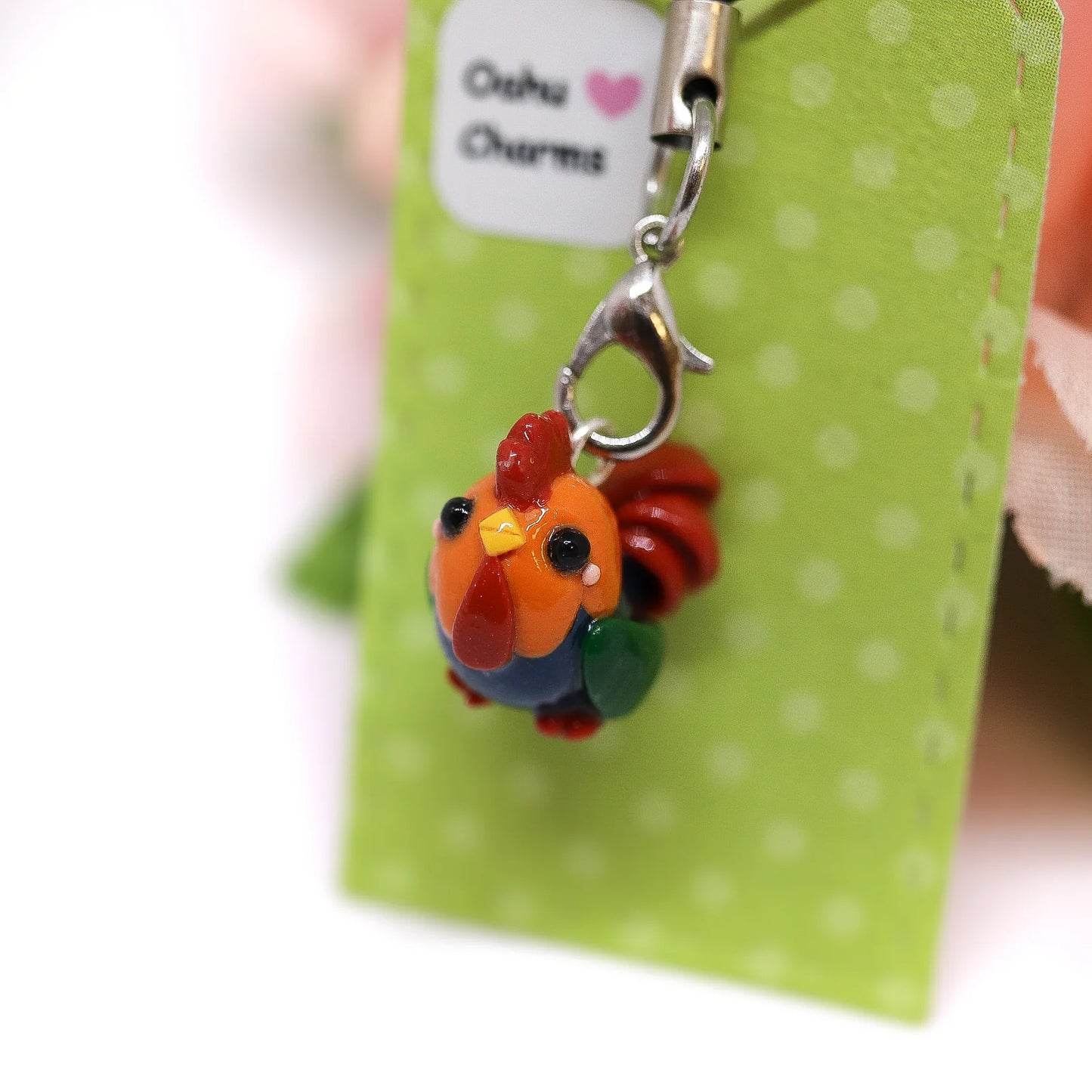 A cute, chubby colorful rooster charm. It has a little comb and yellow beak. This charm can be attached to a cell phone, purse, pouch, stitch marker, earrings, and more!