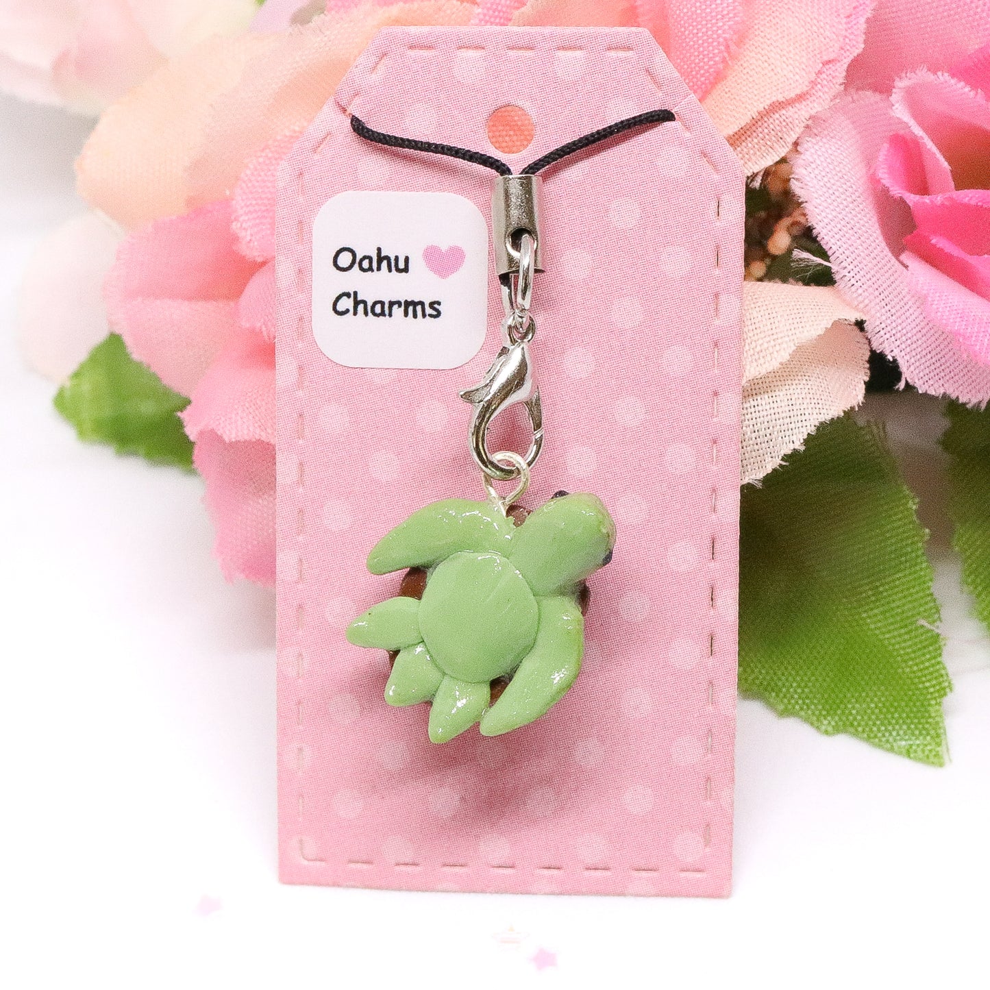A little honu sea turtle charm. Handmade from polymer clay. It has a brown shell and fins that are textured for a realistic effect.