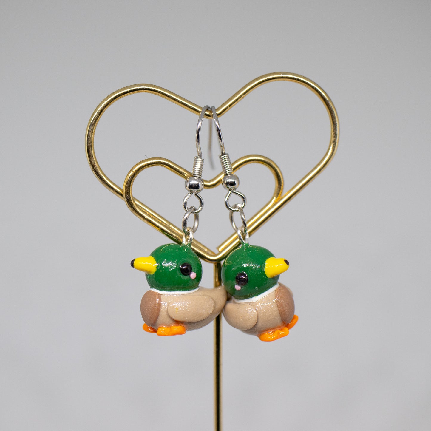 Handmade polymer clay mallard duck charms. Available as a charm or as a pair of earrings.
