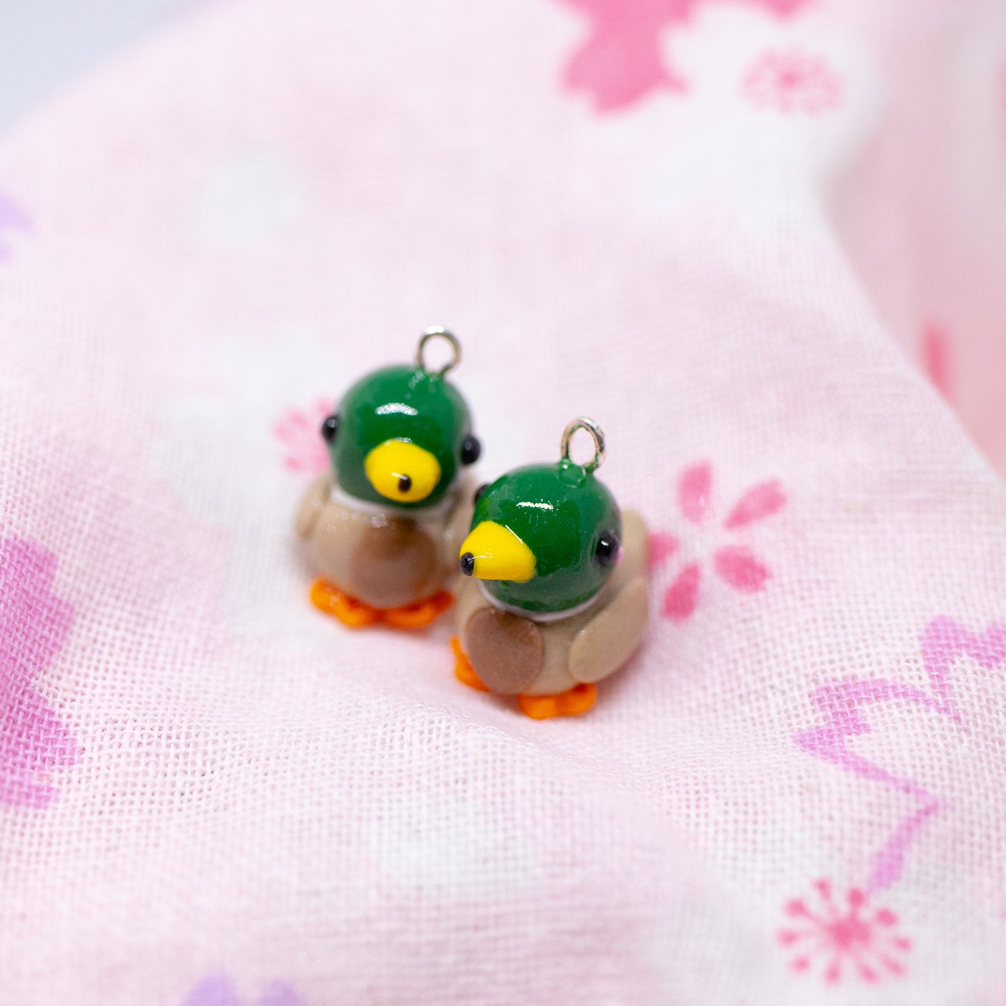 Handmade polymer clay mallard duck charms. Available as a charm or as a pair of earrings.