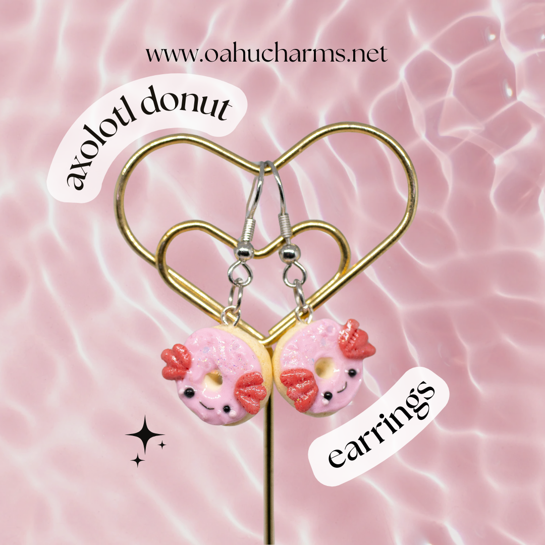 A simple, sparkly axolotl donut earrings.  This charm has a lot of tiny clay details, including like pink frosting and a tiny happy face. Handmade from polymer clay.