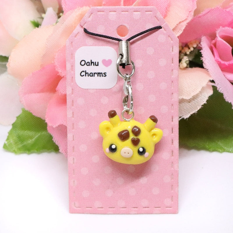 A simple, giraffe clay charm. This little giraffe has lots of tiny details, like a tiny heart on it's forehead and pink blush. Size: 0.75” wide x 0.625” tall