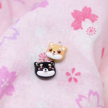 Handmade polymer clay shiba inu charms. Available in two colors: black and tan. Use as a charm or as a pair of earrings.