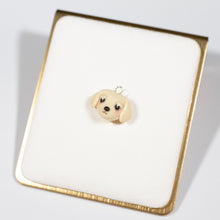 Load image into Gallery viewer, A cute, simple golden retriever dog charm! This little dog has blushing cheeks and sweet, expressive eyebrows. Golden retriever dogs are well known for their gentleness and affectionate nature.
