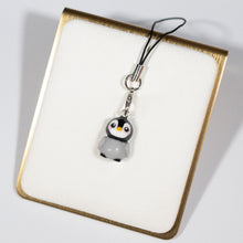 Load image into Gallery viewer, A simple grey and black penguin charm charm with pink cheeks and a little beak.
