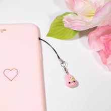 Load image into Gallery viewer, A cute and simple pink bunny charm. This bunny has a small sakura flower and leaf on her head. This bunny has little eyelashes and large, pink ears.This little charm can be hung from a cellphone, planner, or purse!
