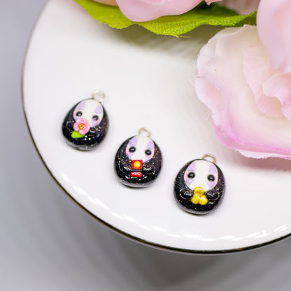 Handmade polymer clay no face charms inspired by the movie spirited away. This listing is for one charm, available in three styles: cherry blossom flower, red bath token, or gold coin.