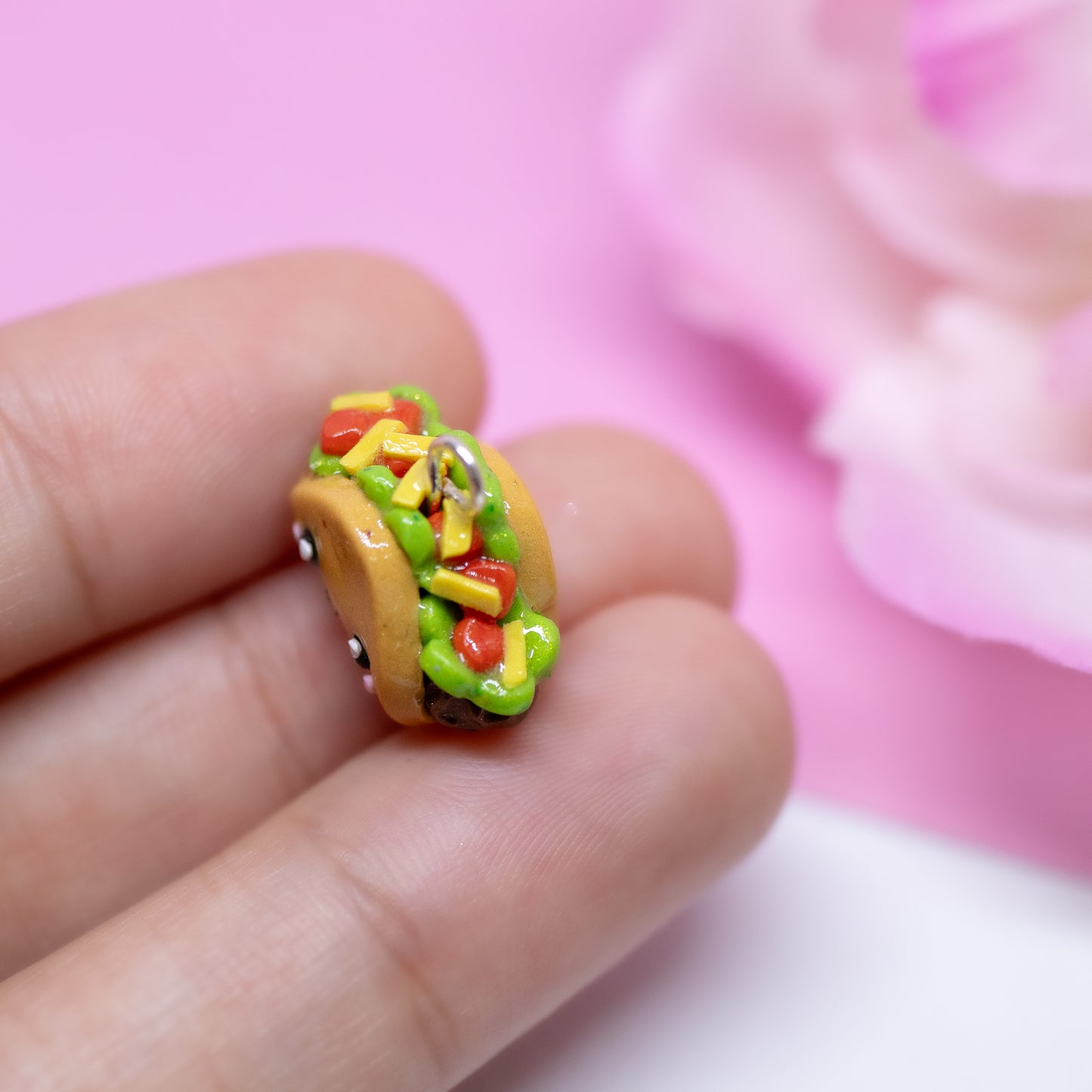 Handmade polymer clay taco charms. Available as a phone charm or pair of earrings. This little taco has a cute smiling face with a lot of toppings like tomatio, cheese and lettuce.