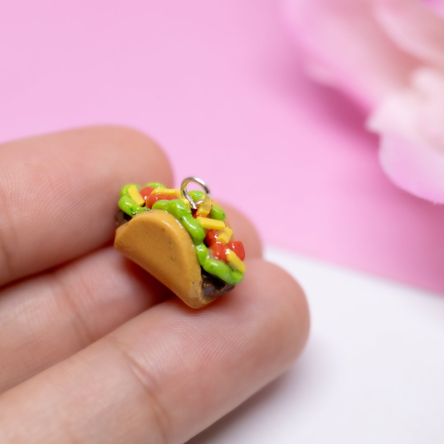 Handmade polymer clay taco charms. Available as a phone charm or pair of earrings. This little taco has a cute smiling face with a lot of toppings like tomatio, cheese and lettuce.