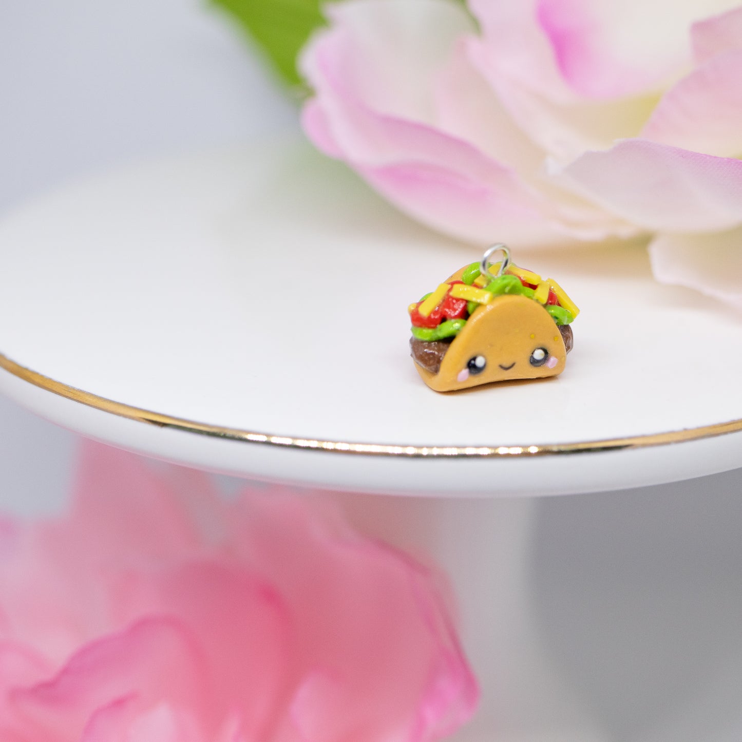 Handmade polymer clay taco charms. Available as a phone charm or pair of earrings. This little taco has a cute smiling face with a lot of toppings like tomatio, cheese and lettuce.