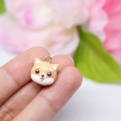 Handmade polymer clay shiba inu charms. Available in two colors: black and tan. Use as a charm or as a pair of earrings.