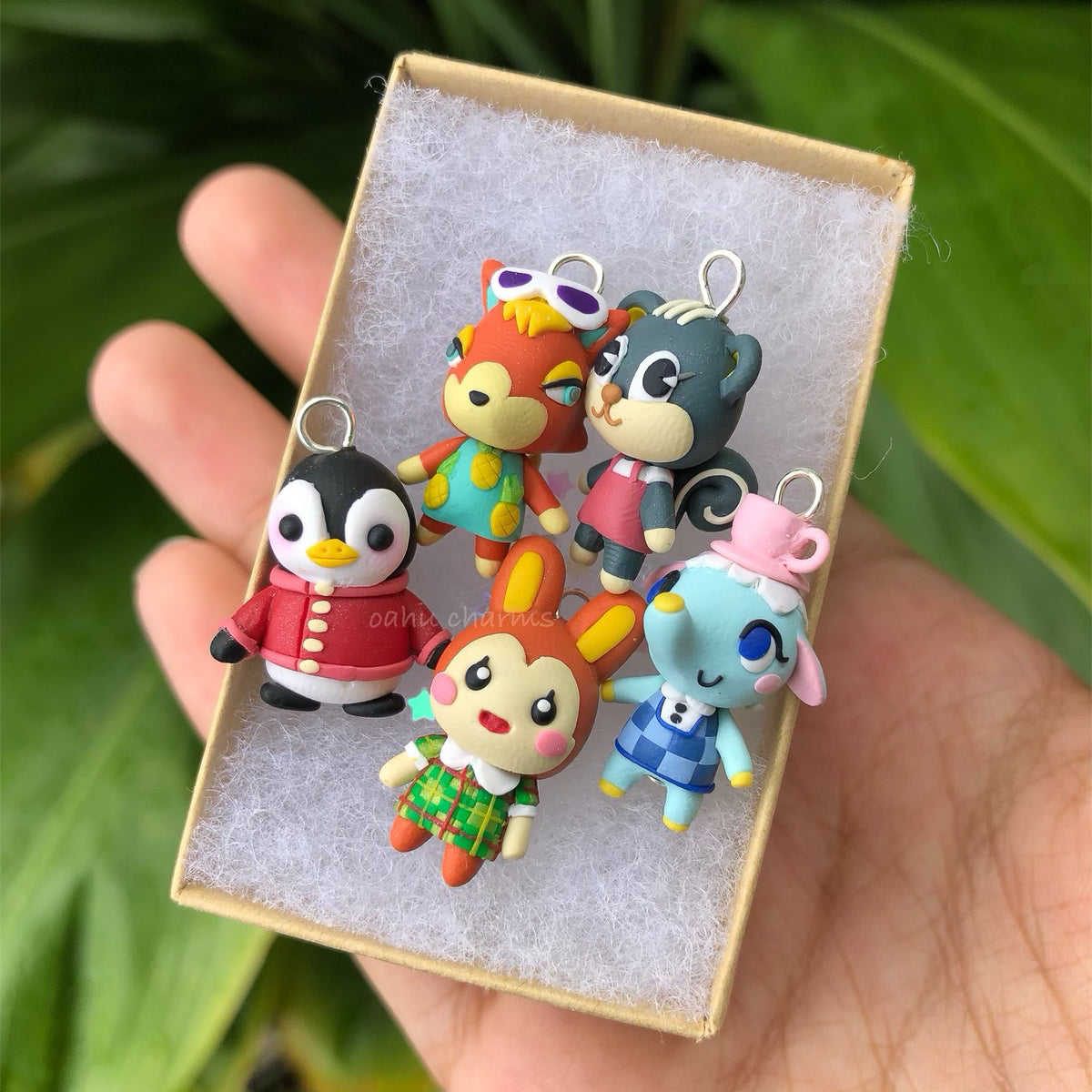 Adorable and tiny animal cossing villager charms. There's 5 villager charms in this photo.