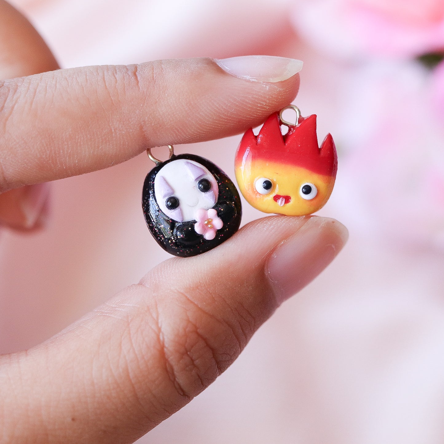 A cute, chubby calcifer charm inspired by the movie, Howl's Moving Castle. This little charm has a cute smile, and tiny pink blush. Handmade from polymer clay.