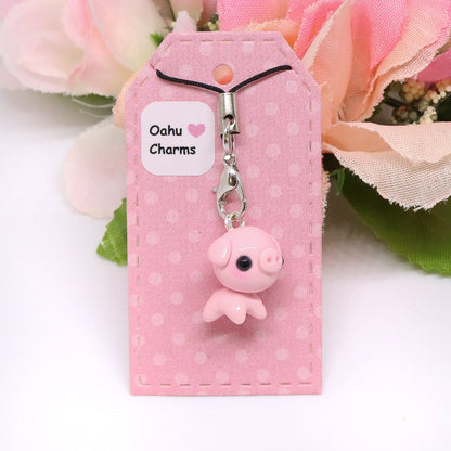 A cute, chubby pig charm. This charm has a lot of tiny details, including a snout and curly tail. Size: 0.75" wide x 0.75" tall