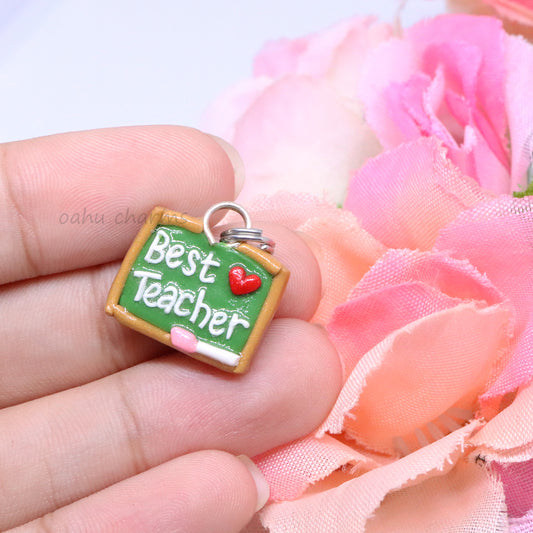 A cute, simple chalkboard polymer clay charm. This little charm has 'Best Teacher' spelled out in clay, with a tiny heart next to it. The perfect, little gift for a special teacher in your life. Handmade from polymer clay.